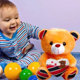 Ведмедик Тедді з сердечком 22 см зі світловими та звуковими ефектами Помаранчевий